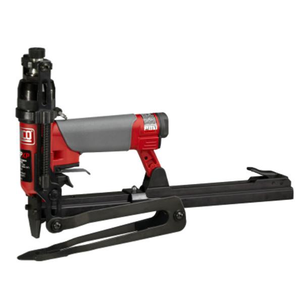 Pneumatic clinching stapler with red top handle and long base, nose downward